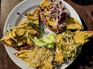 Open sandwich with hummus & sprouts at Bulle Bistro im Glas Lennarz in Dusseldorf