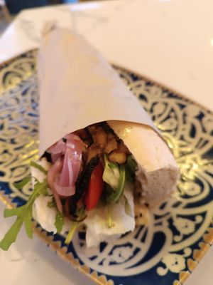 Vegan sandwich with hummus, walnuts, cherry tomatoes, picked onions, arugula and mushrooms at Ma Poulette Liya in Rhodes