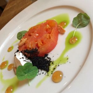 Couer de Boeuf Tomato, confit in olive oil with gentle aromatics, with
whipped smoked almond curds, sherry vinegar jelly and black olive crumb (GF/N) at Oak in Bath