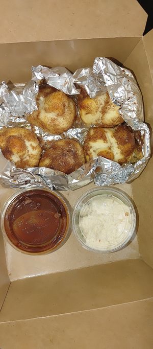 Vegan Cinna knots with icing and chocolate sauce at Sizzle Pie in Eugene