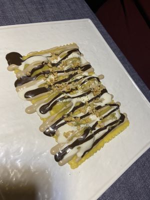 Il quinto gusto - raviolo con porcini con crema di aglio nero   at Soul Kitchen - Creatività Vegetale in Turin