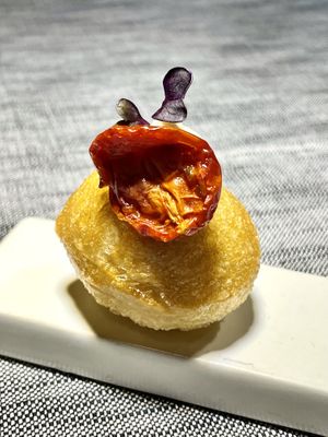 Amuse buche. Focaccina with fermented almond cream and sundried tomato   at Soul Kitchen - Creatività Vegetale in Turin