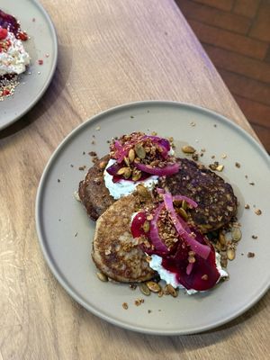 savory pancakes of the day (can be made gluten free) with beetroot, vegan sour cream and pickled onion at Anežka in Prague