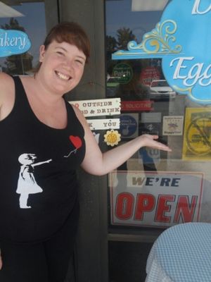 Showing the HappyCow Decal of Excellence window sticker I had just put on!!  at Starry Lane Bakery in San Diego