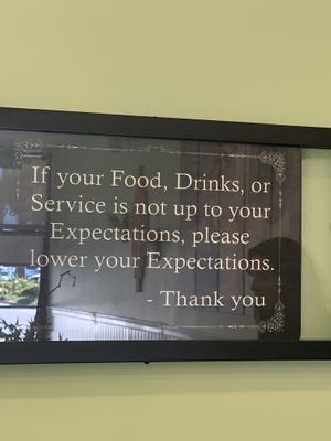 One of the funny things about this sign is there is no need to lower your expectations because the restaurant meets them!!! Thank you Othello's!!  at Othello's in Woodland Hills
