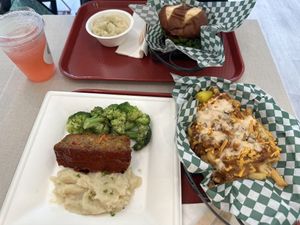 Top left, clockwise: BlackBerry lemonade, garlic mashed potatoes, spicy chicken sandwich, Ultimate fries/tots, and meatloaf plate.   at Othello's in Woodland Hills