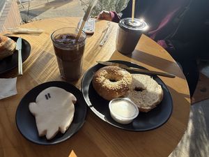 ghost cookie, hazelnut and mocha latte, and sesame seed bagel with vegan cream cheese  at Loaves and Witches in Chicago