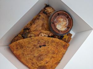 Vegan chick'n quesadilla with sauce. at Chef Richie Deli in Hudson