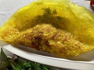 Bánh Xèo, big as your head, contains egg in filling. at Magnolia Veggie Restaurant in Phnom Penh