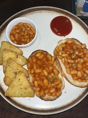 Beans on toast and hash browns  at Mad Monkey Phnom Penh in Phnom Penh