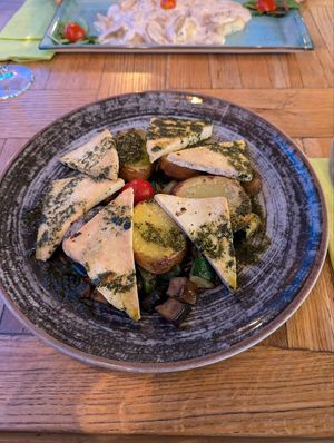 Tofu with basil oil, potatoes and grilled vegies at Aroma Restaurant & Pizzeria in Ljubljana