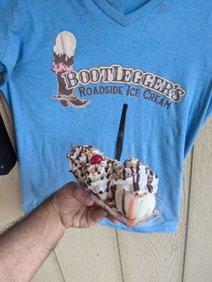 Vanilla, chocolate, and strawberry oat milk ice cream, non-dairy whipped cream and chocolate syrup at Bootlegger's Roadside Ice Cream in Vonore