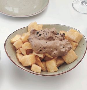 Patatas bravas con allioli de ajo negro at La Capella in Sabadell