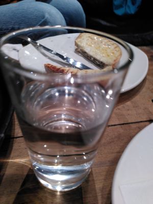 Glass of water (January 2025) at Caffè Nero in Aberystwyth