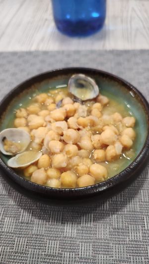 Garbanzos con almejas (también los hacemos solo de verduras) at La Colegiata Food and Drinks in Leon