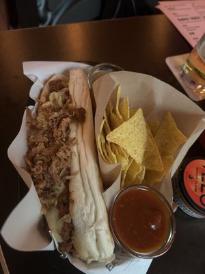Chili cheeze hotdog with nachos and sauces    at 19:77 - VEGAN:DINER+BAR, Home of RAMONES MUSEUM in Berlin