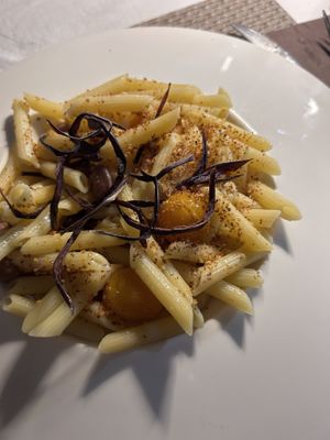Penne con pomodorino giallo, fagioli, bucce di melanzane fritte, pangrattato tostato   at La Nuova Campana in Castellammare Del Golfo