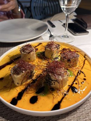 Roll di verdure e funghi su crema di pomodori gialli e pesto di rucola, guarnito con pistilli di pesto di rucola   at La Nuova Campana in Castellammare Del Golfo