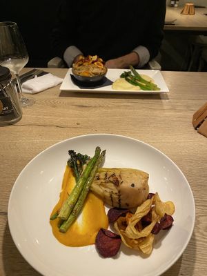 Front: vegan cabbage steak, back: vegan stew  at Waanzinnig Tilburg in Tilburg