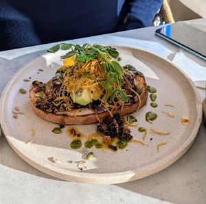 Mushrooms with chili oil on toast at Hudson & Rosie's Table in Highland Park