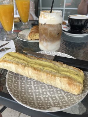 Greek Potato pie and Oat milk iced latte   at Bakery and Coffee Shop Nisaki in Corfu
