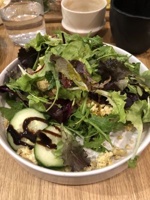 tofu scramble open face sandwich topped with salad leaves   at Café marais in Konstanz