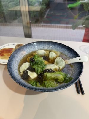 Mushroom dumplings in a broth   at XinAn Vegan - 心安素食 in Guangzhou