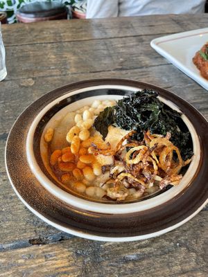 Bean stew, lemon aioli, frizzled onions, crispy kalee  at SUBCULT in Amsterdam