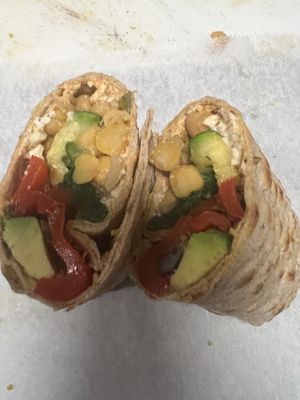 Hummus & Veggie Wrap: A refreshing blend of hummus, chickpeas, grilled zucchini, spinach, roasted red pepper, wrapped to perfection in a whole-grain tortilla. at Taste Haven Healthy Cafe & Meal Prep in Seaford