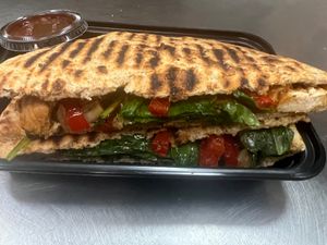 BBQ vegan protein, vegan cheese, spinach, grilled onions, all perfectly grilled on whole-wheat or regular wheat panini bread. at Taste Haven Healthy Cafe & Meal Prep in Seaford