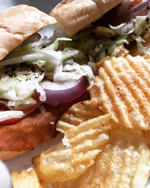Corned “beef” sandwich with Herbivorous Butcher cheese and meat at Muffin Top Bakery in Redlands
