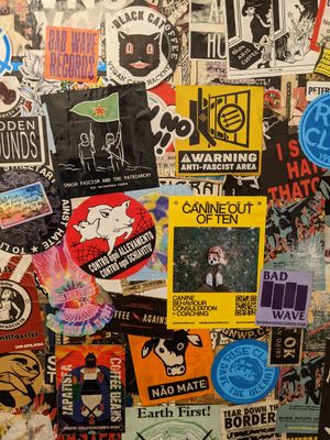 Wall of vegan stickers in toilet at Black Cat in East London