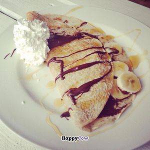 Crepe with chocolate and banana filling and whipped cream & maple syrup... at Black Cat in East London