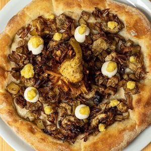 Artichoke King Tower: rosemary potatoes, fried artichoke, fresh citrus pesto, and cashew creamy cheese at Pit'sa in Milan