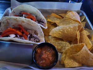 Steak tacos subbed with Impossible crumbles (omitted the cheese and queso) with chips and salsa at The Brass Tap in Plano