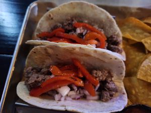 Steak tacos subbed with Impossible crumbles (omitted the cheese and queso) at The Brass Tap in Plano