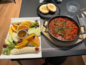Fruit platter and vegan shakshuka  at Bitter in Tirana