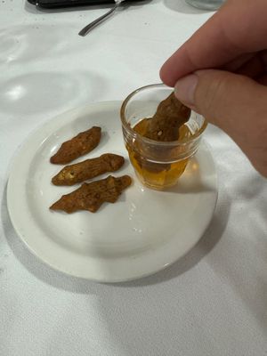 Sweet wine & crispy biscuits! at Ristorante La Forgia Maurizio - 9852 Vulcano Home Restaurant in Vulcano