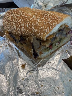 Half of a vegan fried eggplant with vegan mozz and pesto   at Filoncino Cafe  in Red Bank