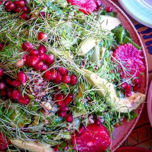 green salad  with  nuts  avocanto pomegranates and grapefruits  at Tranquilo in Santorini