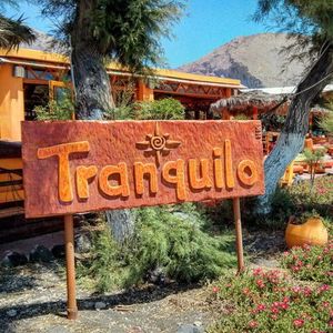 The  hand made wooden  sign ,  gift from  N. Kavadias,  deticated friend. at Tranquilo in Santorini