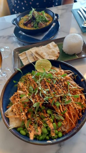 Poke bowl near, coconut-y curry thing far. at La Brise in Jersey