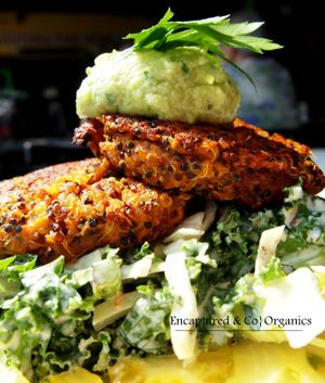 Two Sweet Potato Quinoa Cakes! Our oven roasted, Organic Sweet Potatoes, Tricolor Quinoa, Sage & Garlic make up this Vegan & Gluten Free Special served on a bed of Caesar Veggie Salad with our garden Yellow Tomatoes topped with Avocado Tahini Sauce!  at Sprouts Cafe in Gastonia