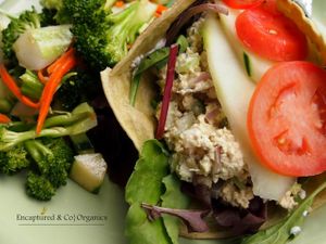 Mock Chicken Wrap! Organic, Non GMO Tofu squeezed by hand and blended with Fresh Celery, Red Onion & Garlic before being seasoned with Whole Pepper, Thyme, Veganaise Wrapped in a Spinach Tortilla with Lettuce, Tomato & Cucumber!   at Sprouts Cafe in Gastonia
