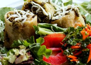 Sauteed, Organic Green Veggies with Feta and Romano Cheese Baked into a Golden Brown Puff Pastry Sprinkled with Mozzarella Cheese served over Fresh Romaine Lettuce dressed with a Simple White Balsamic Dressing and Drizzle of Hemp seed Pesto.   at Sprouts Cafe in Gastonia