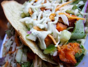 Chunky Veggie Tacos! Hearty Veggie filled Tacos made with Roasted Dumpling Squash, Shredded Spicy Lime, Veggie Slaw, Creamy Avocado Aioli, Cucumber Pico de Gallo, and a Sprinkle of Cheddar and Mozzarella Cheeses on 2 Warm Spinach tortillas!  at Sprouts Cafe in Gastonia