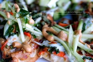 Thai Veggie Pizza topped with Thai Peanut Sauce, Julianne Carrots, Celery, Kale, and a Light Mozzarella topped with a Cucumber Parsley Salad!  at Sprouts Cafe in Gastonia