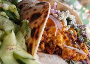  Buffalo Style Grilled Tofu Wrap! Our Organic, Non GMO Tofu frilled in a Traditional buffalo Sauce topped with Cheddar and served on a Gluten Free Wrap with Buffalo Sauce Aioli, Blue Cheese Crumbles and Coleslaw.  at Sprouts Cafe in Gastonia