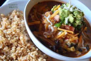 Veggie and Bean Chili made with Black & Red Beans, Onion, Peppers, Garlic, Carrots, Butternut Squash, Tomatoes and Kale topped with tasty Pico de Gallo, Tangy Avocado, Cheddar and Mozzarella cheeses!  at Sprouts Cafe in Gastonia
