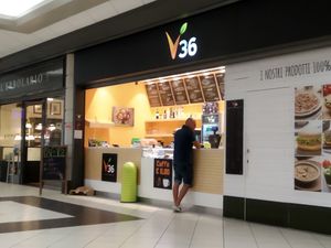 Inside a shopping center at V36 Bar & Vegan Food in Savona